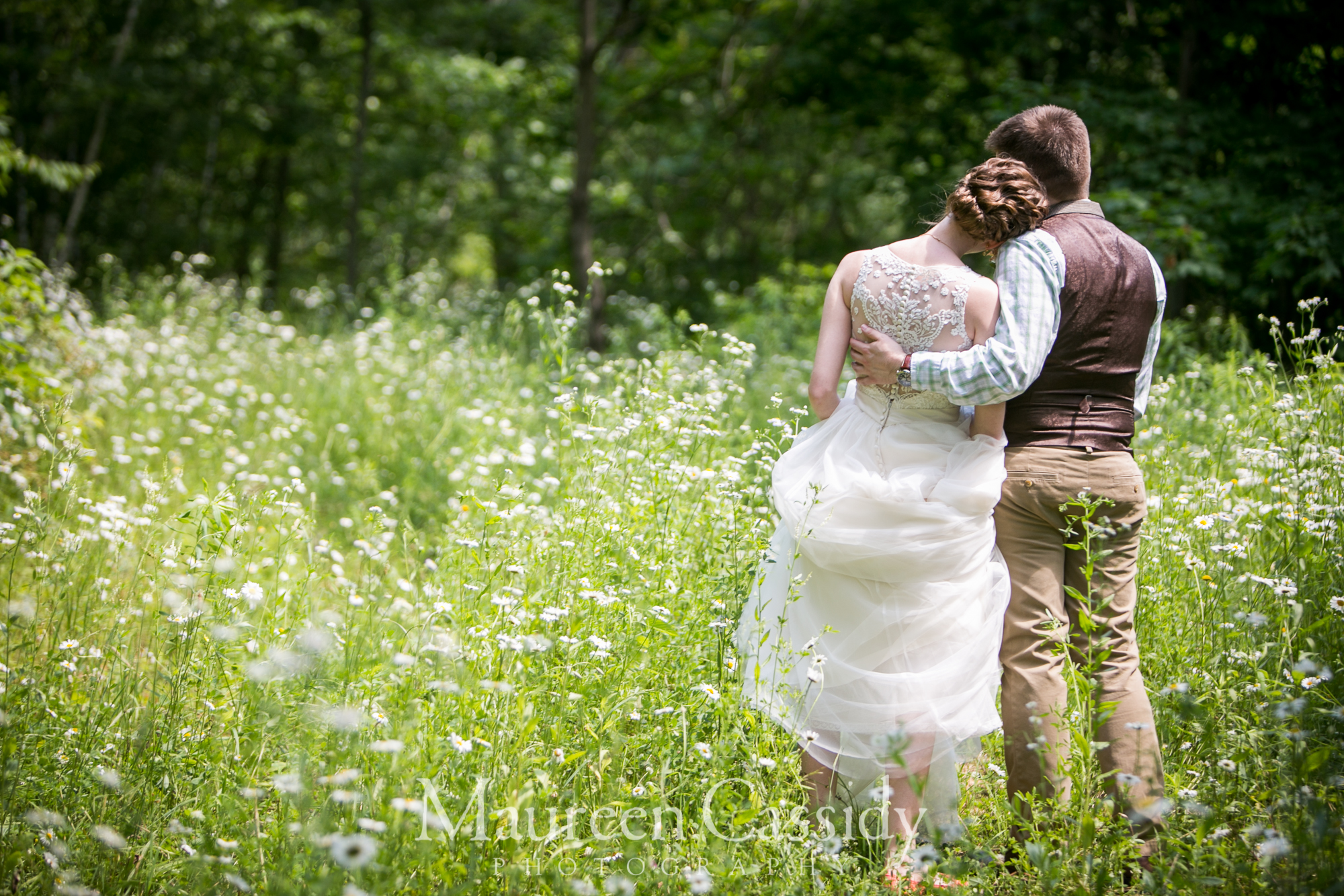 wedding at cashton barn B&B  groom holding bride canind